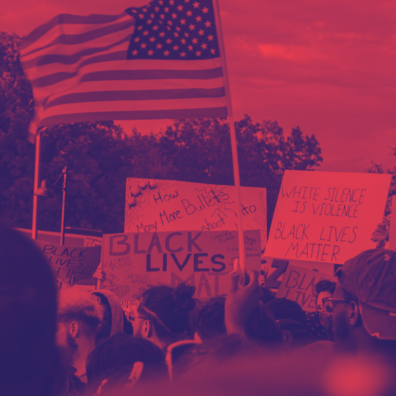 Image shows a protest for Black Lives Matter with a red and navy blue filter on it. People are holding a flag and protest signs.