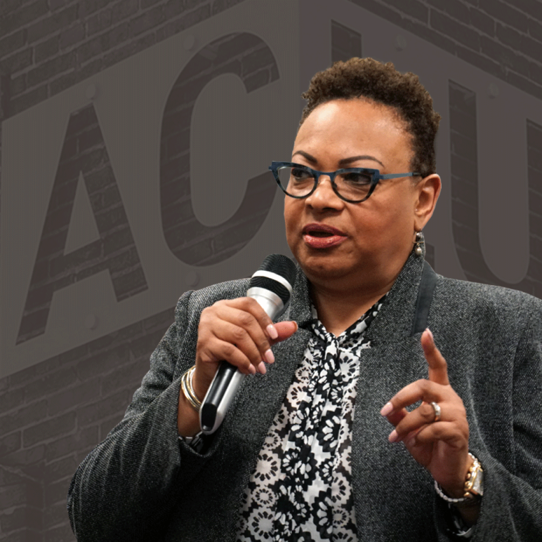 Dana Vickers Shelley is in the foreground and a picture of the ACLU sign and brick wall is in the background with a dark gray brown overlay.