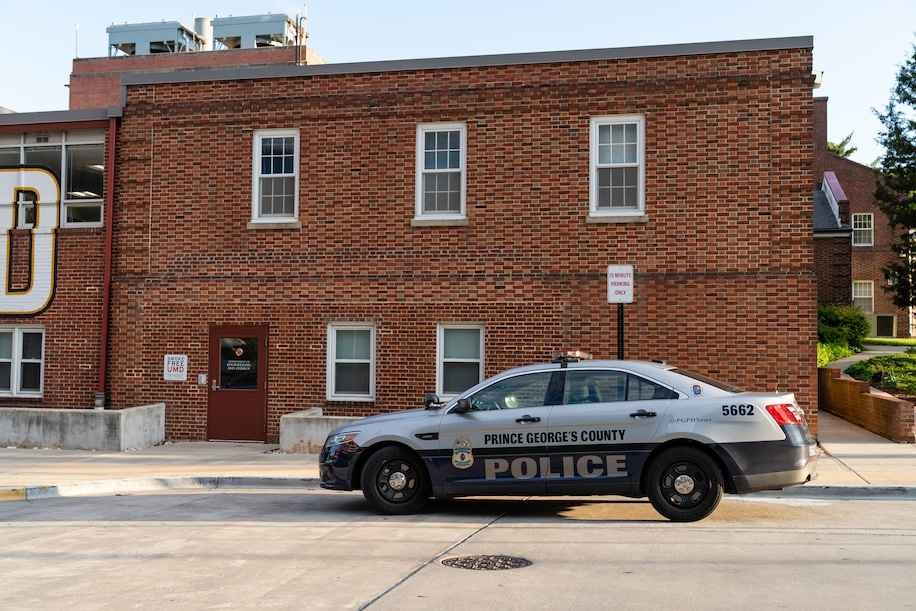 Prince George's County police cruiser in front of a brick building