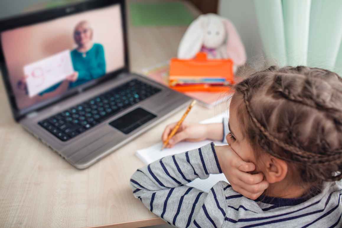 young girl working on a laptop