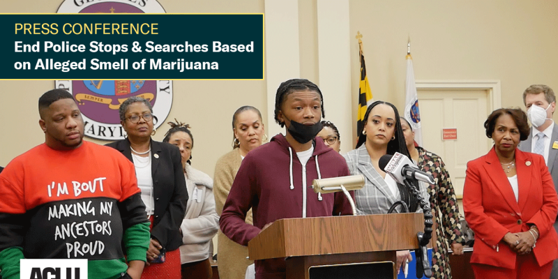 Press Conference: End Police Stops & Searches Based on Alleged Smell of Marijuana. Group of mostly Black advocates are standing behind a podium. A young Black man is at the podium telling his story.