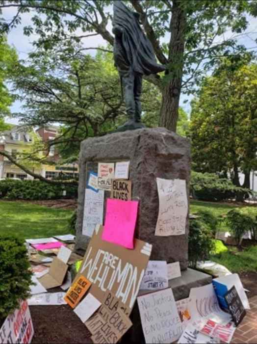 Talbot County Confederate statue is in the center and the base is surrounded by protest signs.