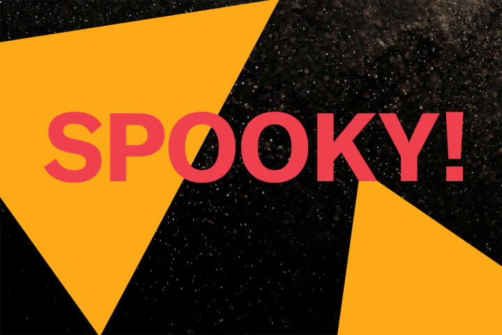 Image says "Spooky!" Background is balck with white specks. Dark yellow triangles are on the right and left sides.