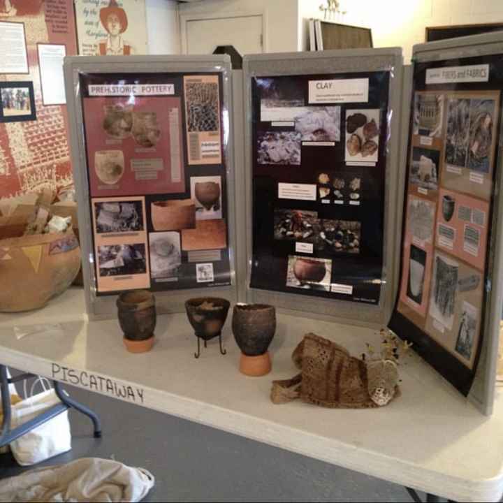 Display of history, photos, and pieces of pottery from a class the Cedarville Band of the Pisctaway Indians offered at their cultural center.