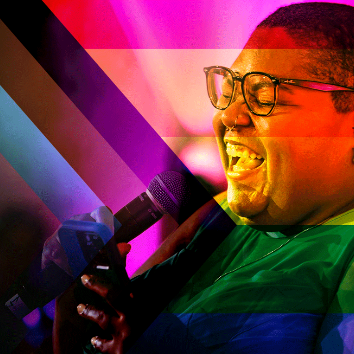 Picture of Alicia Smith signing into a microphone. The image is filtered on a progress pride flag and the colors are all blended.