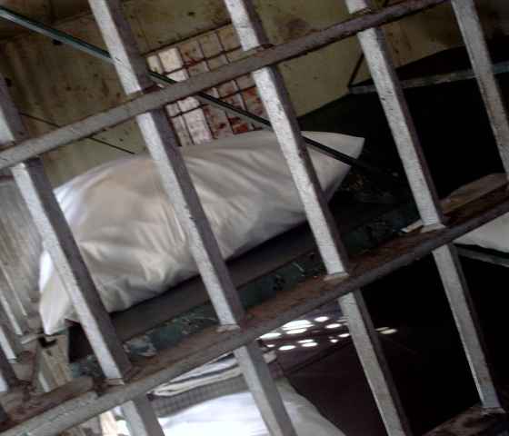 Jail cell with pillow